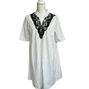 Silky smooth white dress with black lace trim. Size M